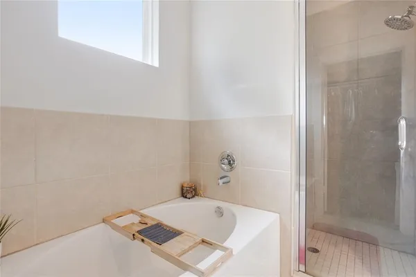a bathroom with a tub and sink