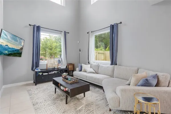 a living room with furniture and a window