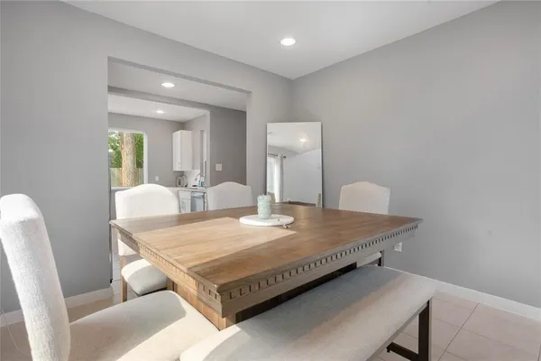 a living room with dining table