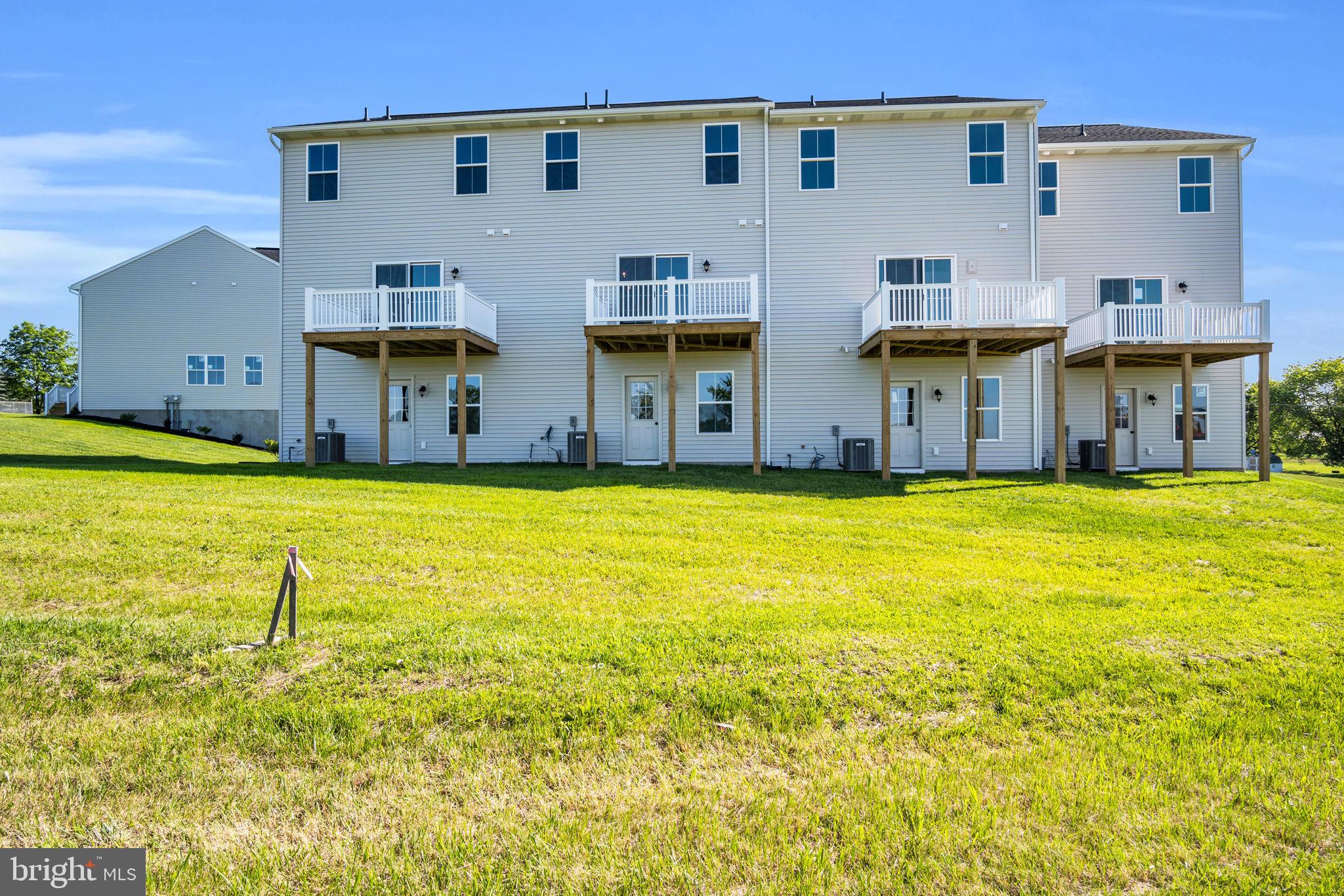 6 Morgan Drive, Unit 1203 Carlisle, PA 17015 - Photo 2 of 13 a view of an ocean with a big yard