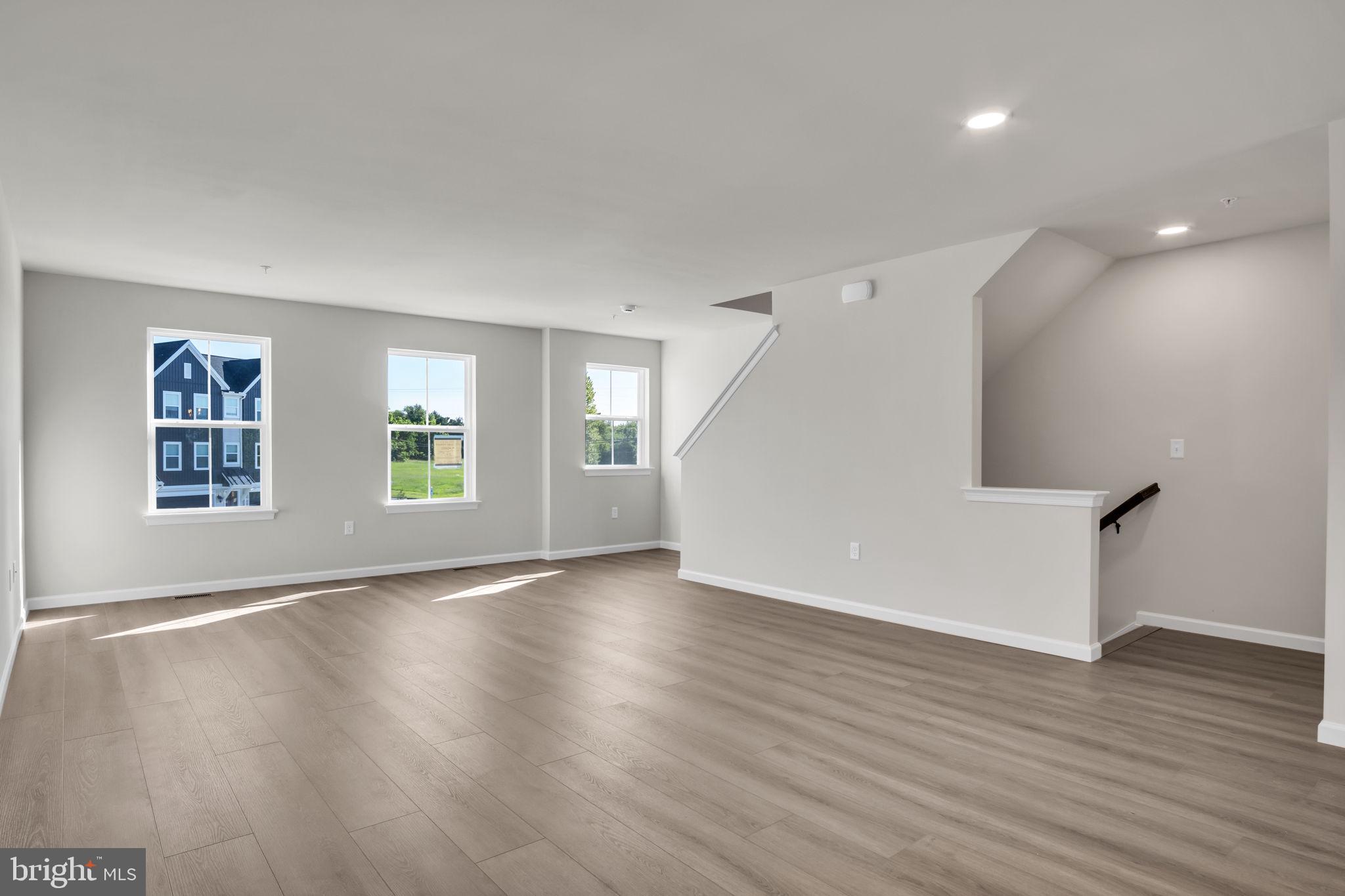 6 Morgan Drive, Unit 1203 Carlisle, PA 17015 - Photo 7 of 13 an empty room with wooden floor and windows