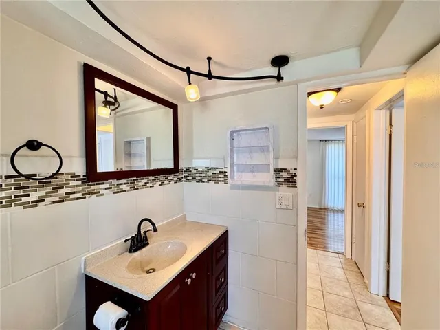 a bathroom with a sink and a mirror