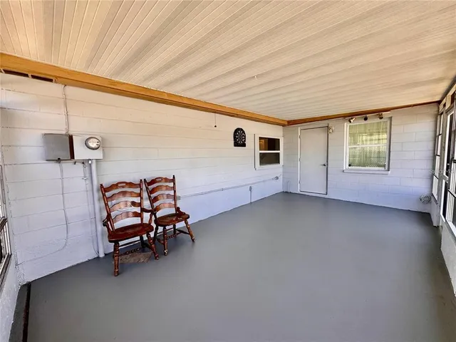 a view of a livingroom with furniture and windows