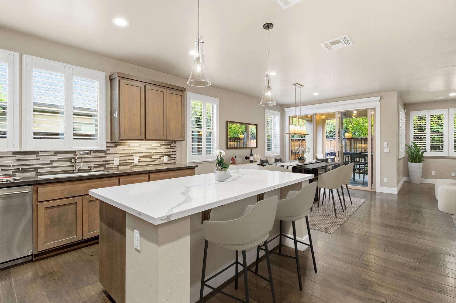 309 Fairgate Road Sacramento, CA 95825 - Photo 15 of 48 a kitchen with a table chairs sink and cabinets