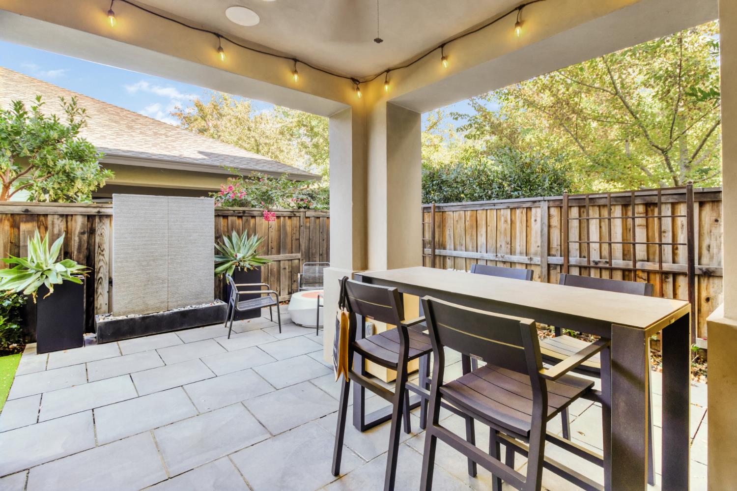 309 Fairgate Road Sacramento, CA 95825 - Photo 20 of 48 a patio with table and chairs and potted plants