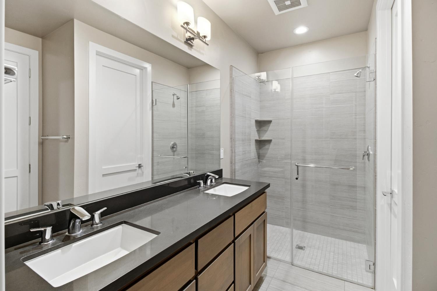 309 Fairgate Road Sacramento, CA 95825 - Photo 23 of 48 a bathroom with a sink double vanity and a shower