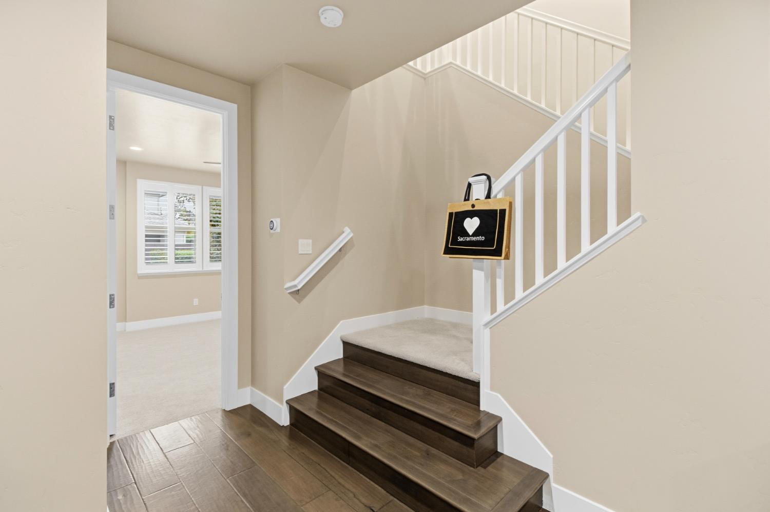 309 Fairgate Road Sacramento, CA 95825 - Photo 24 of 48 a view of staircase with wooden floor and white walls