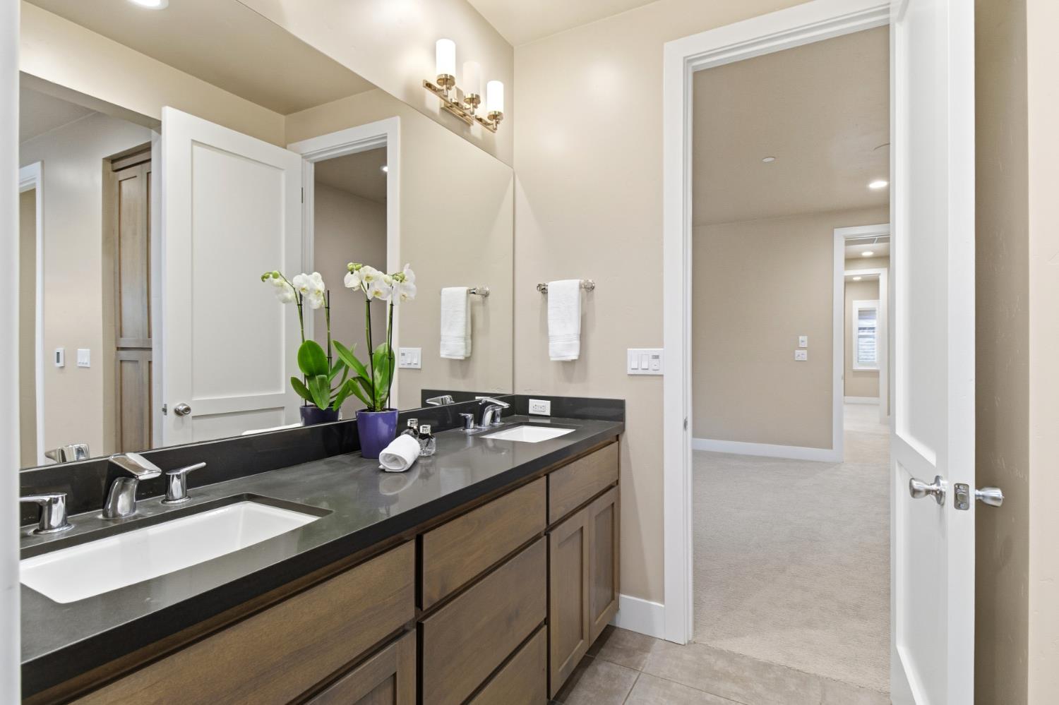 309 Fairgate Road Sacramento, CA 95825 - Photo 27 of 48 a bathroom with a granite countertop sink and a mirror