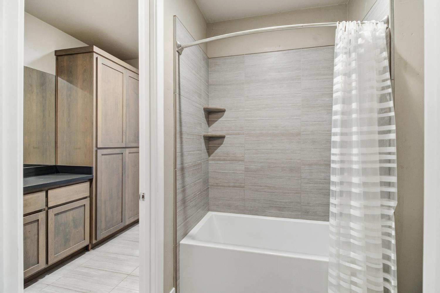 309 Fairgate Road Sacramento, CA 95825 - Photo 36 of 48 a bathroom with a bathtub and a shower