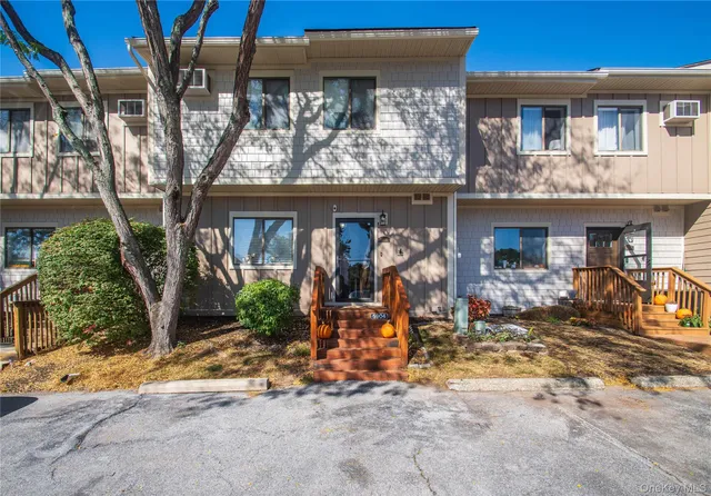 a view of a car park in front of retail shop