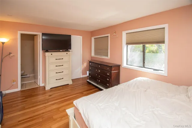 a living room with furniture and flat screen tv