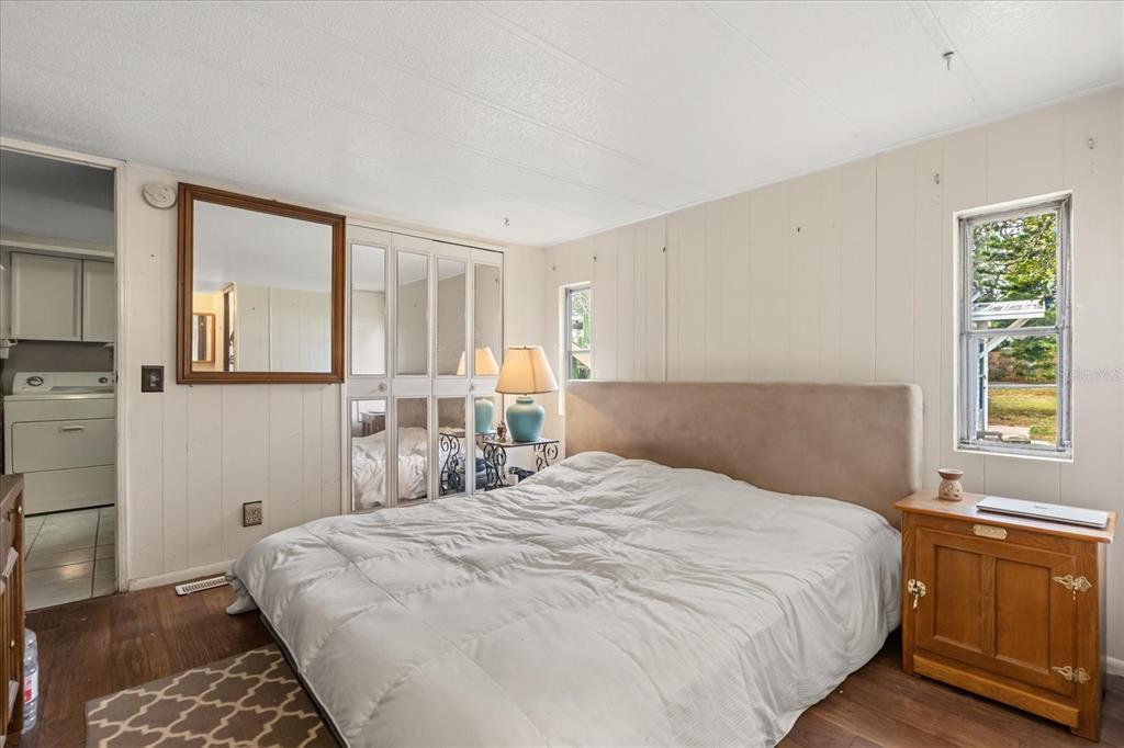 1960 Pinewood Lane Mount Dora, FL 32757 - Photo 5 of 12 a bedroom with a bed and a window