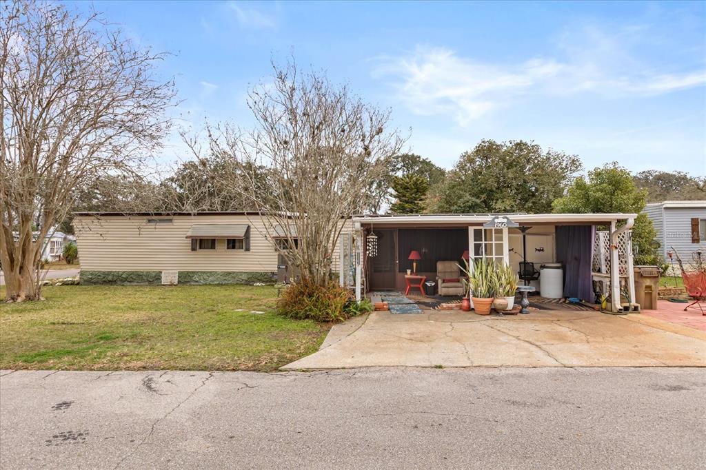 1960 Pinewood Lane Mount Dora, FL 32757 - Photo 7 of 12 a view of a house with backyard and sitting area