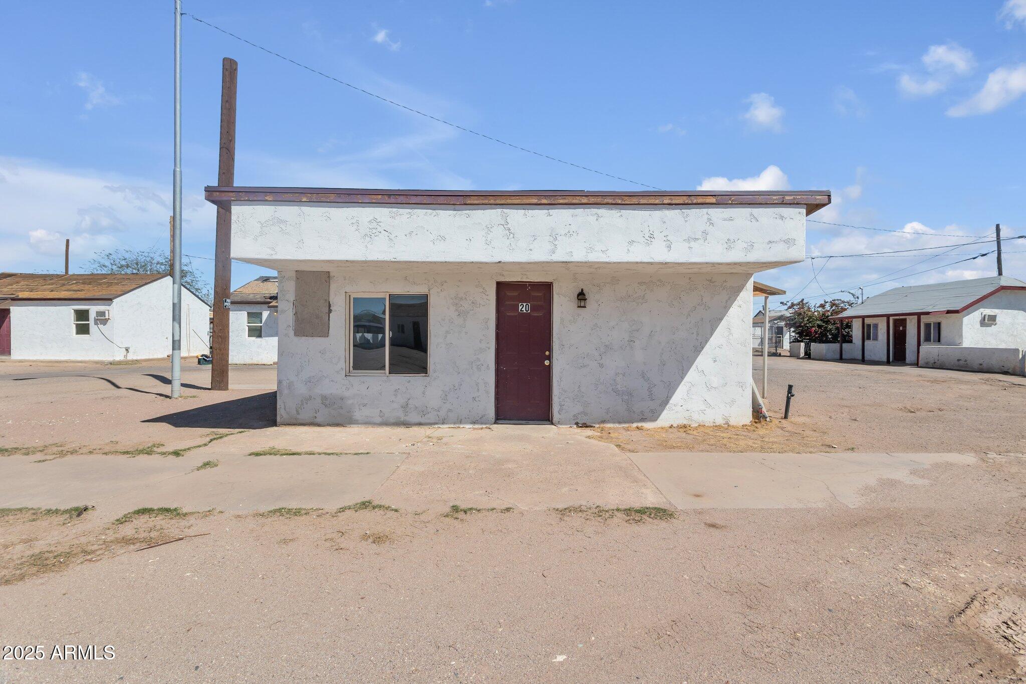 313 West Jones Avenue Phoenix, AZ 85041 - Photo 6 of 28 a front view of a house with a outdoor space