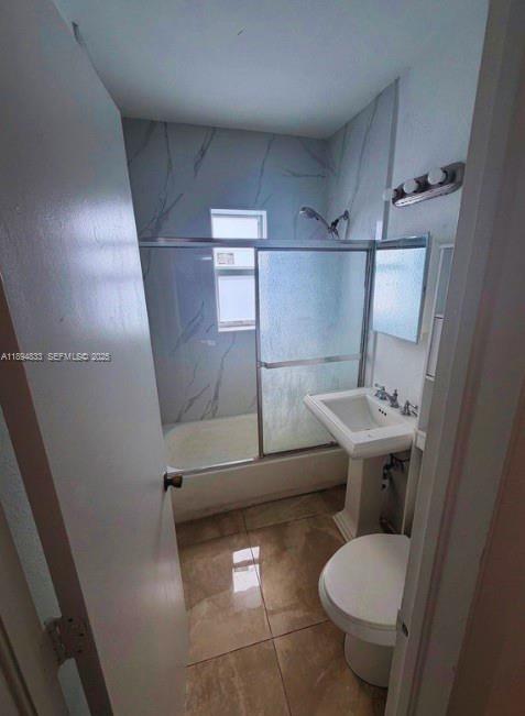 438 Northwest 84th Terrace, Unit 438 Miami, FL 33150 - Photo 11 of 20 a bathroom with a sink toilet and shower