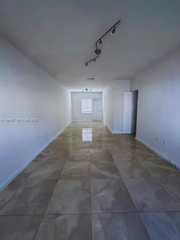 a view of hallway with natural light