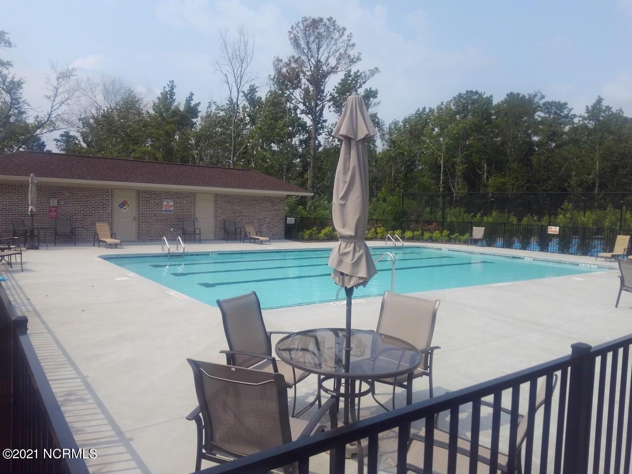 520 Motts Forest Road Wilmington, NC 28412 - Photo 10 of 15 Amenities include 2 clubhouses, 2 swimming pools, pickleball courts, tennis court, putting green and parks.
