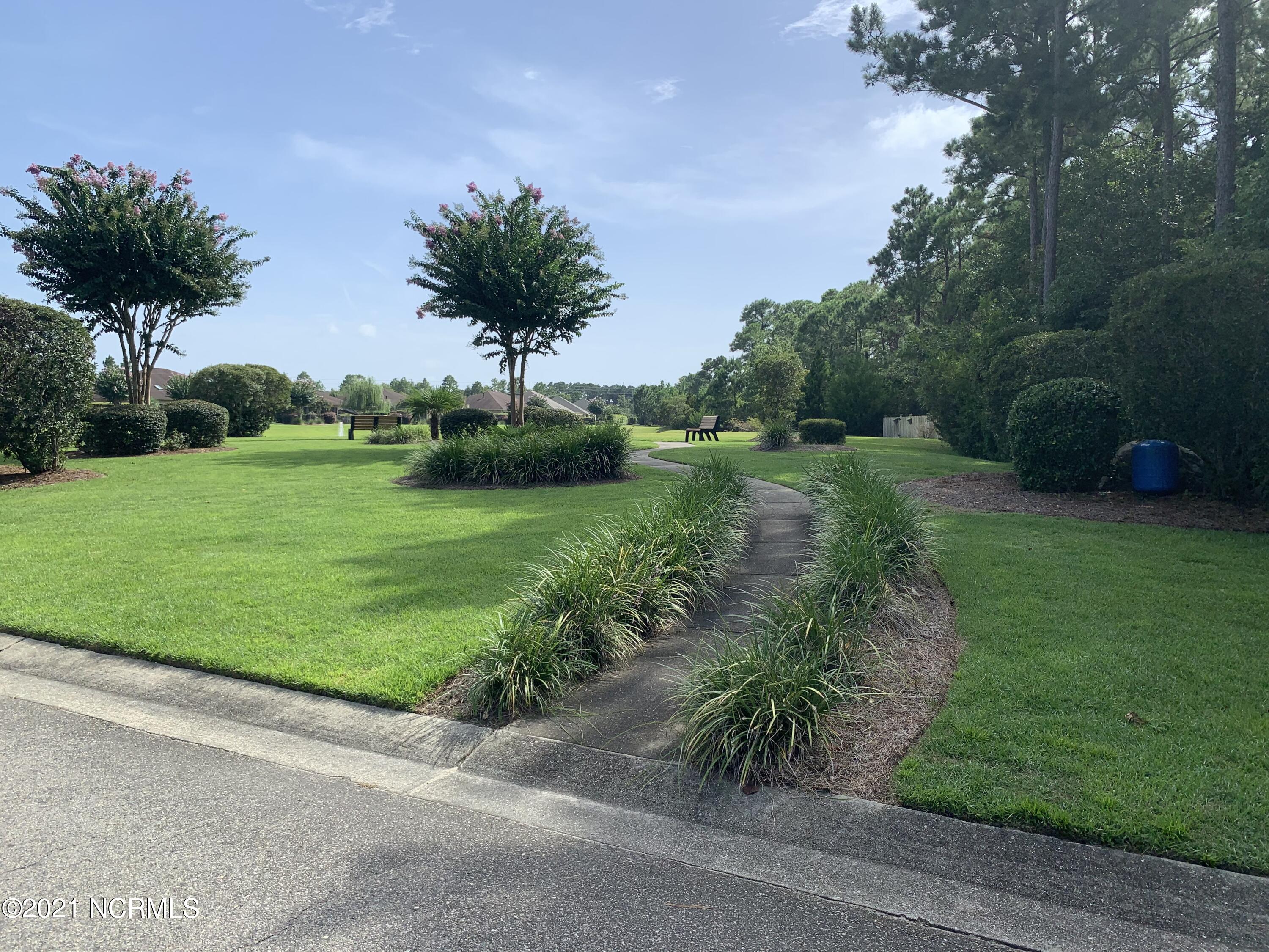 520 Motts Forest Road Wilmington, NC 28412 - Photo 13 of 15 Amenities include 2 clubhouses, 2 swimming pools, pickleball courts, tennis court, putting green and parks.
