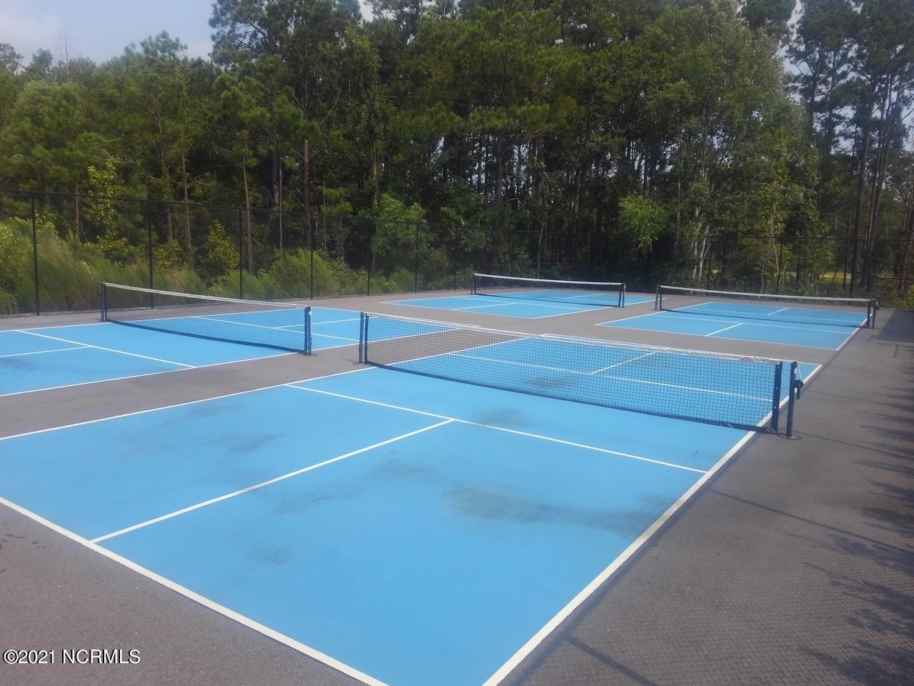 520 Motts Forest Road Wilmington, NC 28412 - Photo 7 of 15 Amenities include 2 clubhouses, 2 swimming pools, pickleball courts, tennis court, putting green and parks.