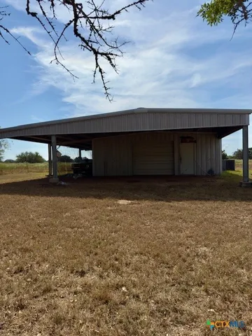 a view of a garage with parked cars