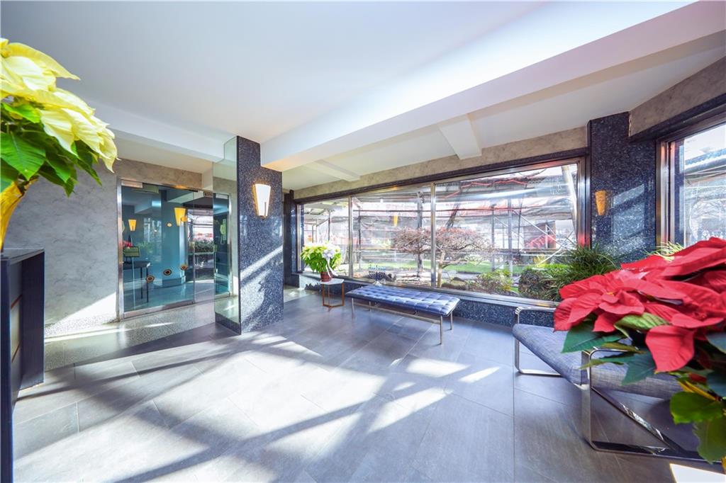 8901 Shore Road, Unit 7B Brooklyn, NY 11209 - Photo 2 of 12 a lobby with furniture and floor to ceiling window