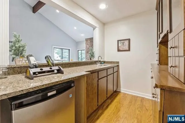 a en suite bathroom with a sink and a mirror