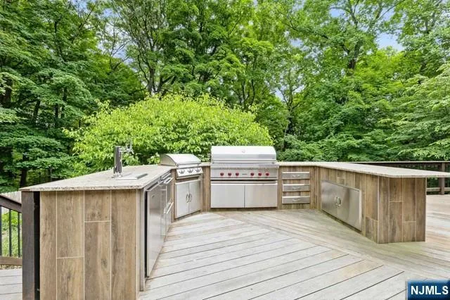a bathroom with a granite countertop sink a toilet and a mirror