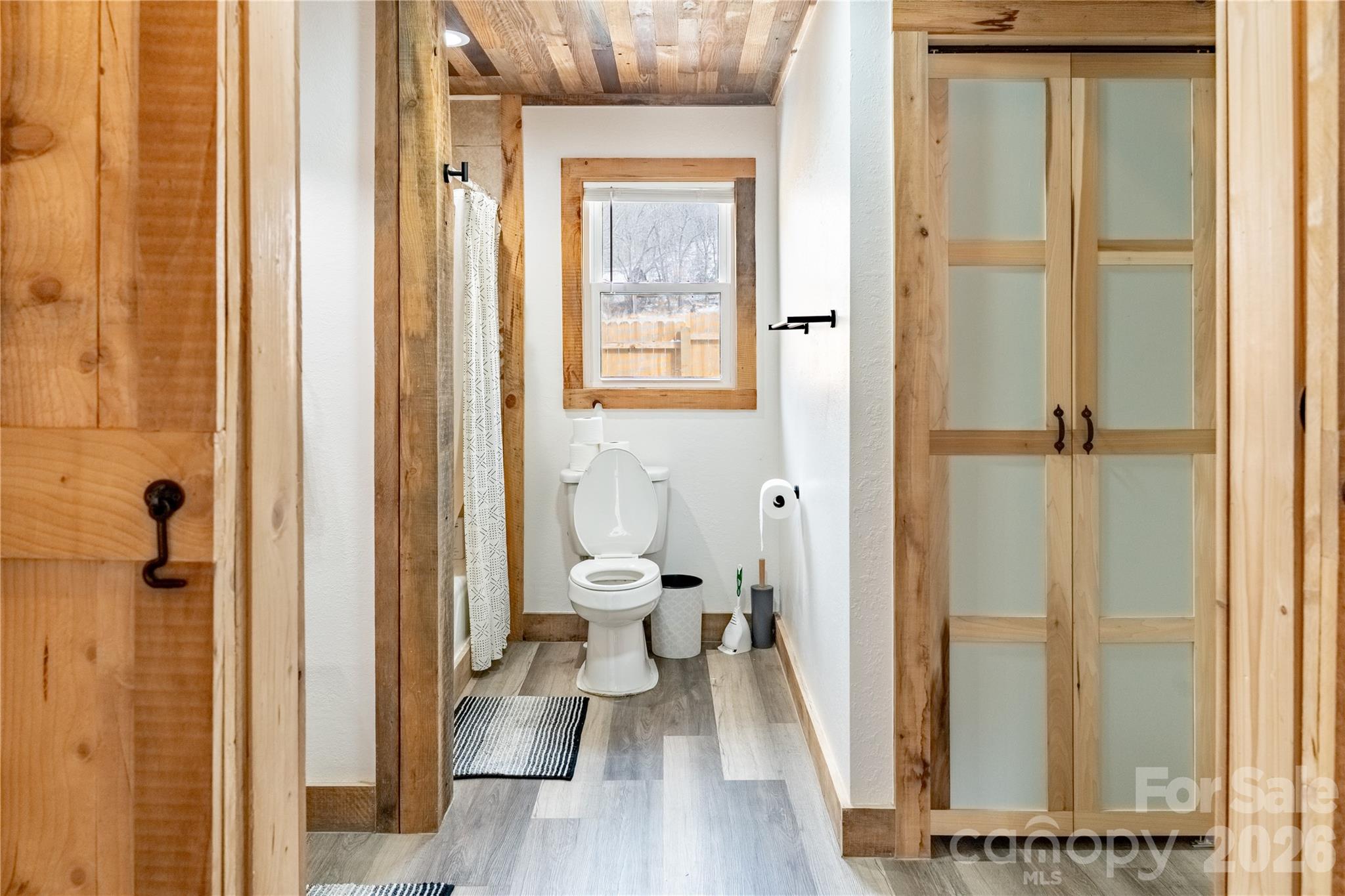 8573 Cruso Road Canton, NC 28716 - Photo 8 of 15 a bathroom with a sink and a glass door shower