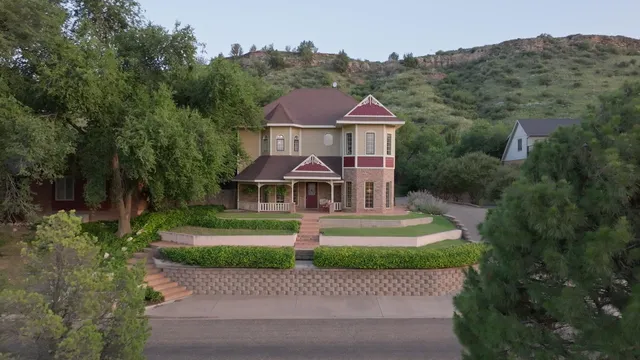 an aerial view of a house with a garden