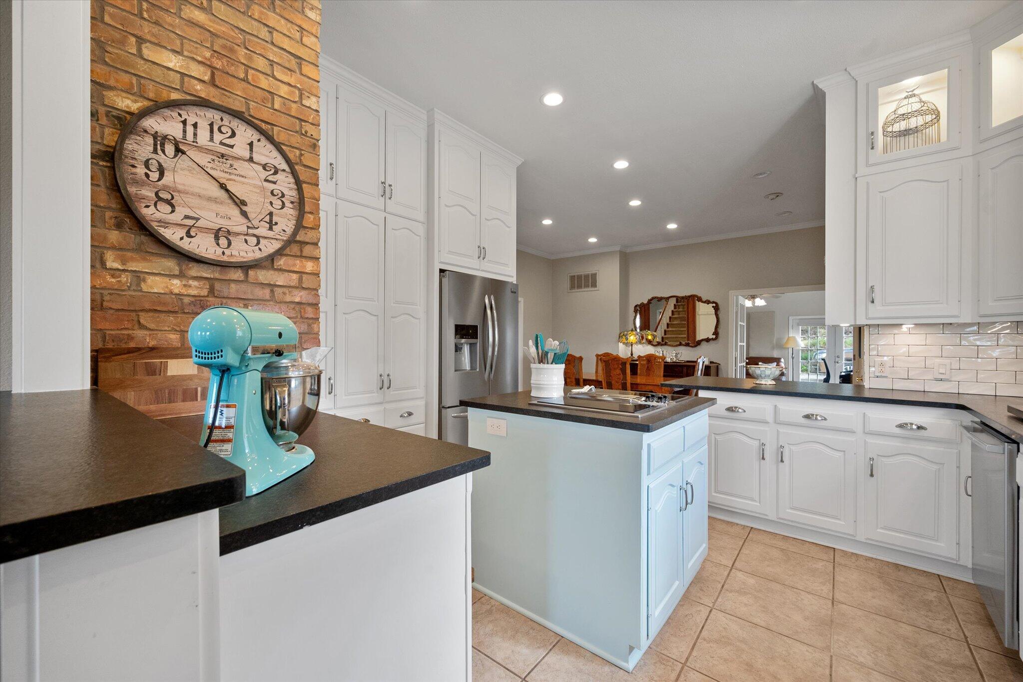 67 South Lake Shore Drive Ransom Canyon, TX 79366 - Photo 22 of 52 a kitchen with stainless steel appliances granite countertop a sink a stove and a refrigerator