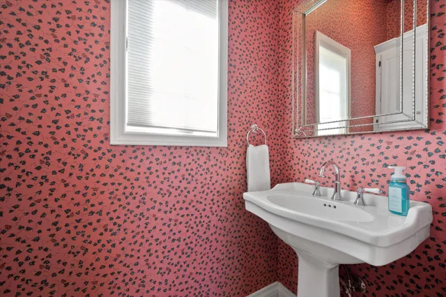 a view of a livingroom with workspace and a window