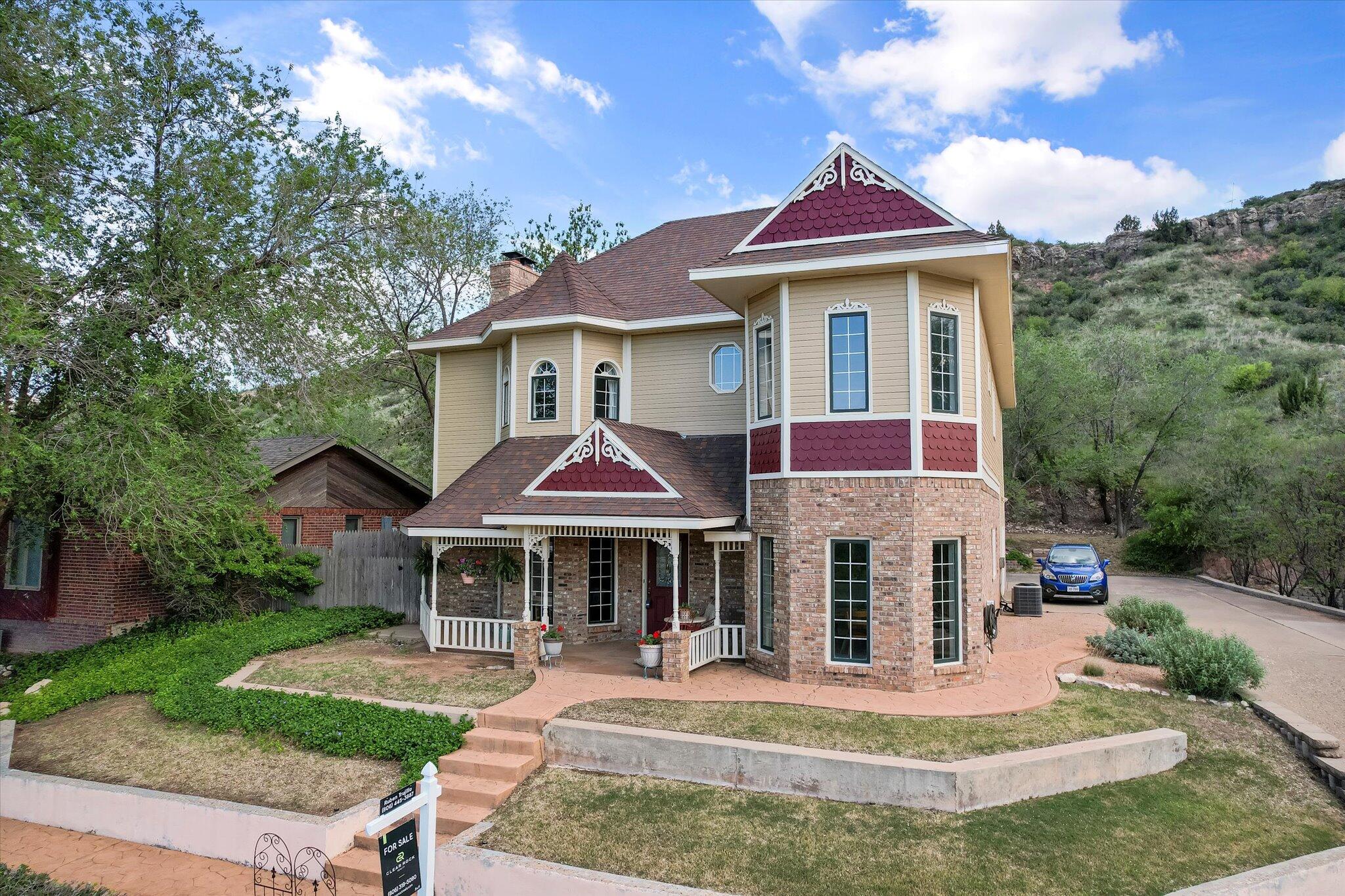 67 South Lake Shore Drive Ransom Canyon, TX 79366 - Photo 3 of 52 a front view of a house with a yard