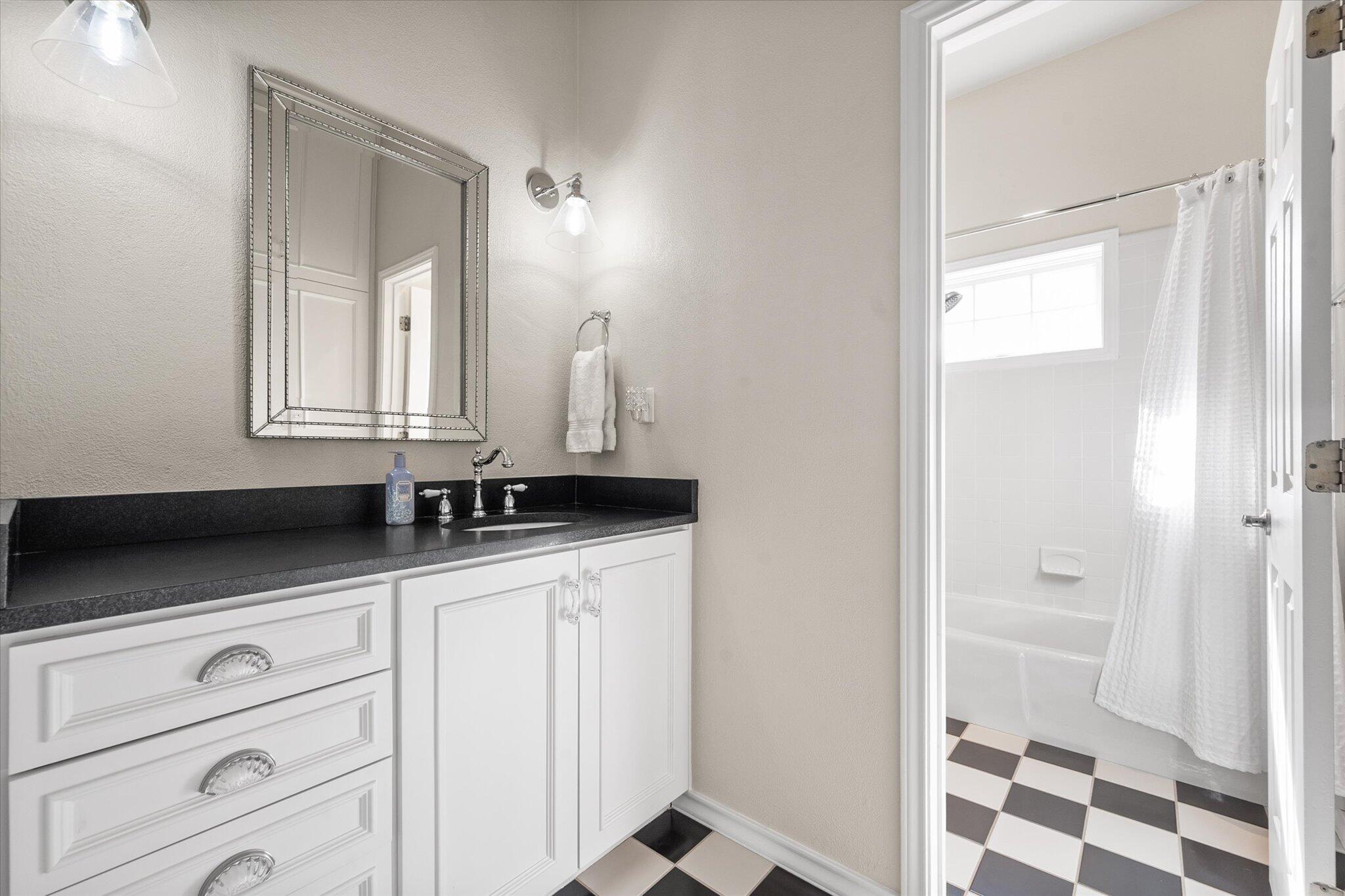 67 South Lake Shore Drive Ransom Canyon, TX 79366 - Photo 39 of 52 a bathroom with a sink a vanity and a mirror