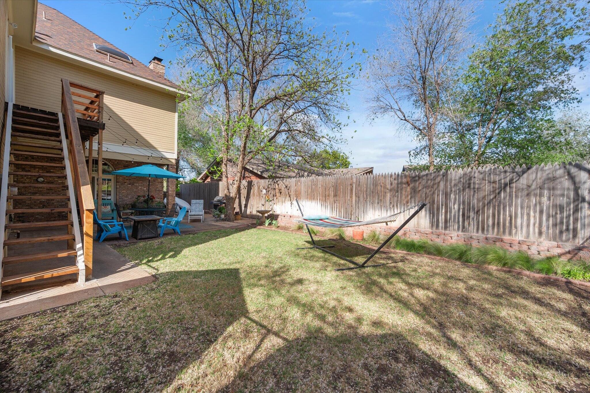 67 South Lake Shore Drive Ransom Canyon, TX 79366 - Photo 49 of 52 a view of a yard with a tree
