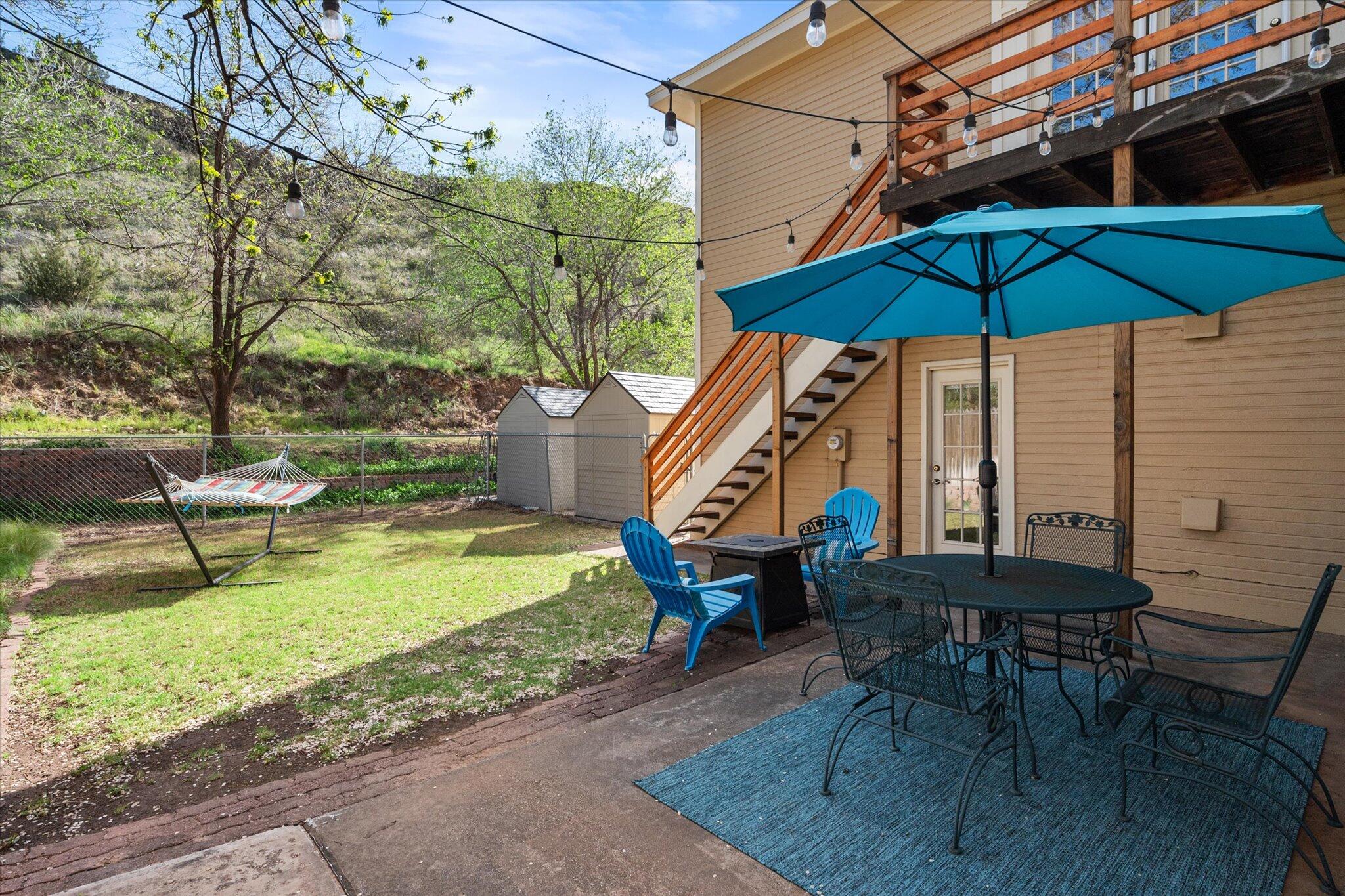 67 South Lake Shore Drive Ransom Canyon, TX 79366 - Photo 51 of 52 a chair and tables in the patio