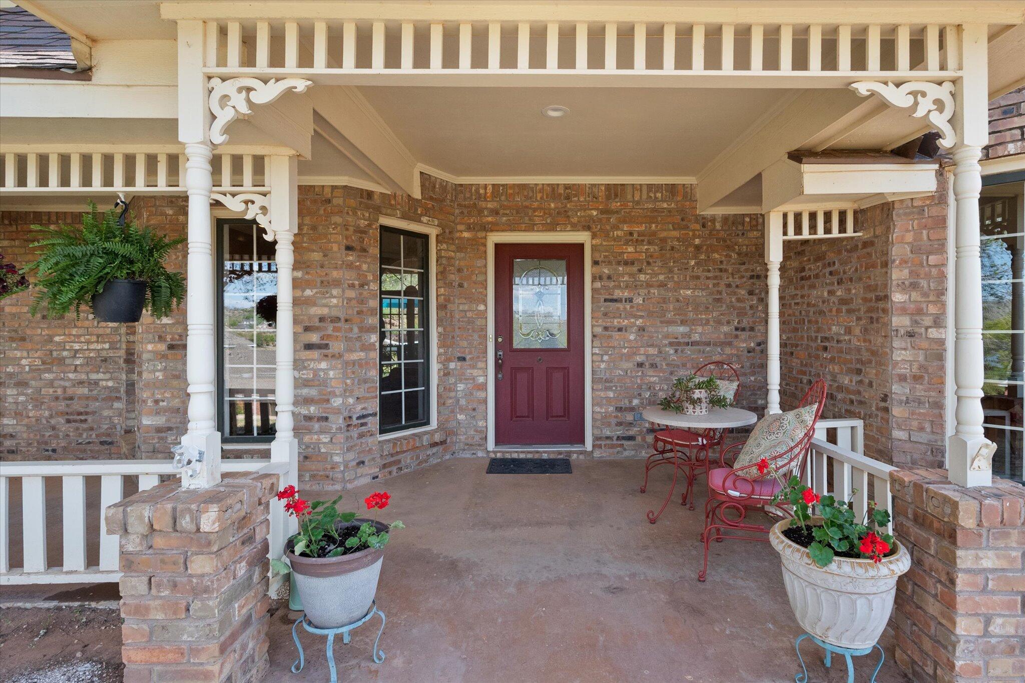 67 South Lake Shore Drive Ransom Canyon, TX 79366 - Photo 6 of 52 a view of a house with potted plants