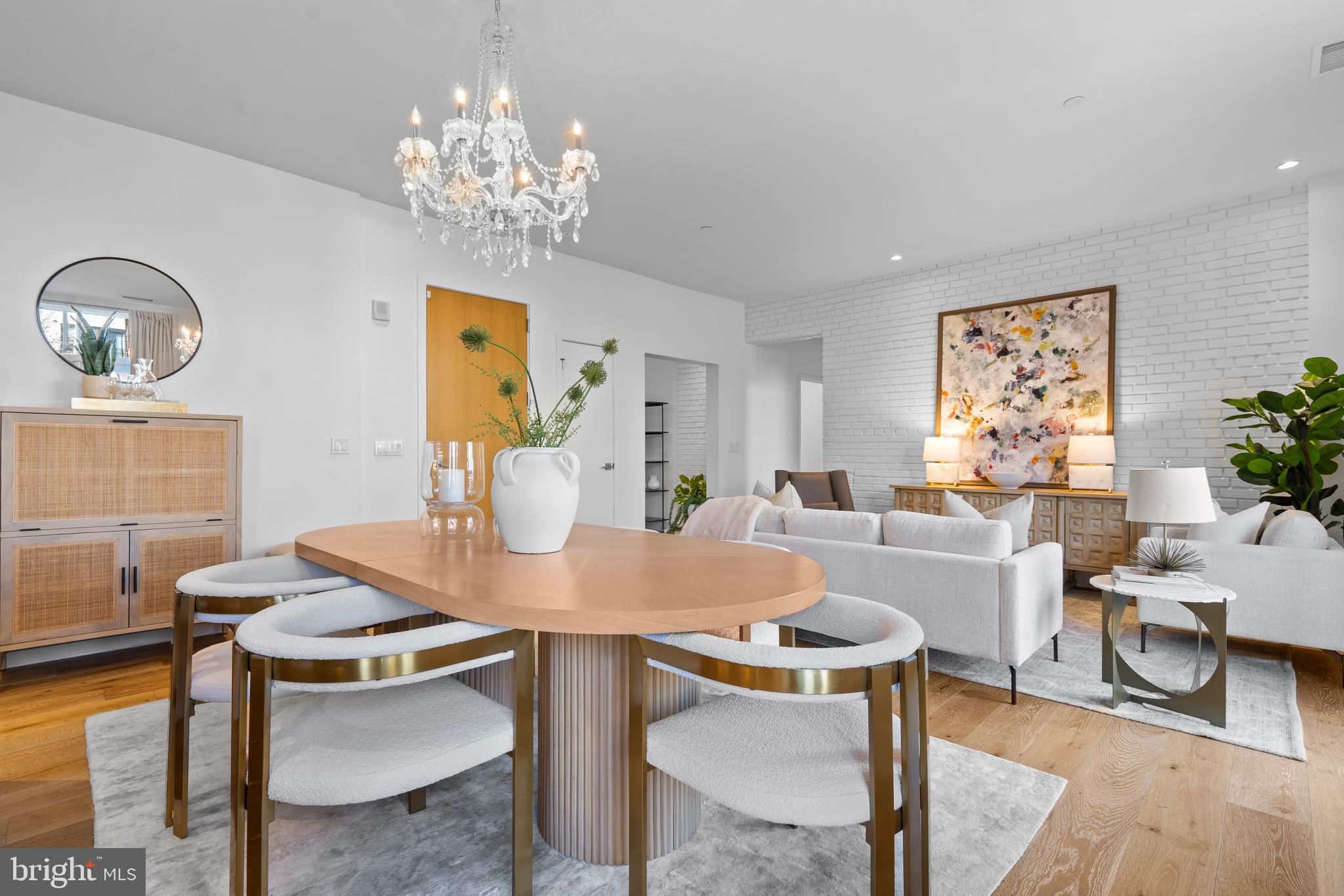 1324 E Street Southeast, Unit 201 Washington, DC 20003 - Photo 15 of 47 a view of a dining room with furniture and chandelier
