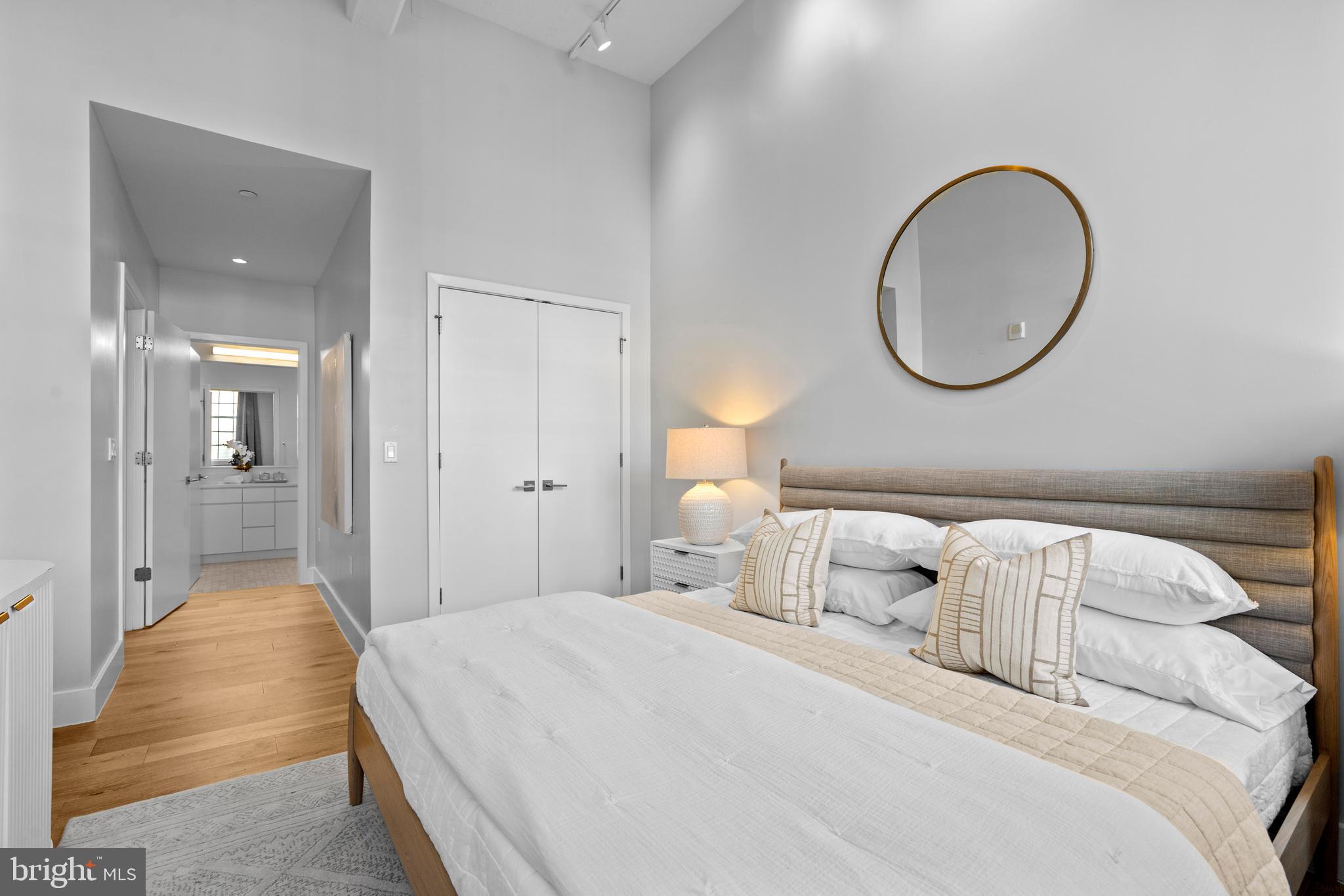 1324 E Street Southeast, Unit 201 Washington, DC 20003 - Photo 22 of 47 a bedroom with a bed and a mirror