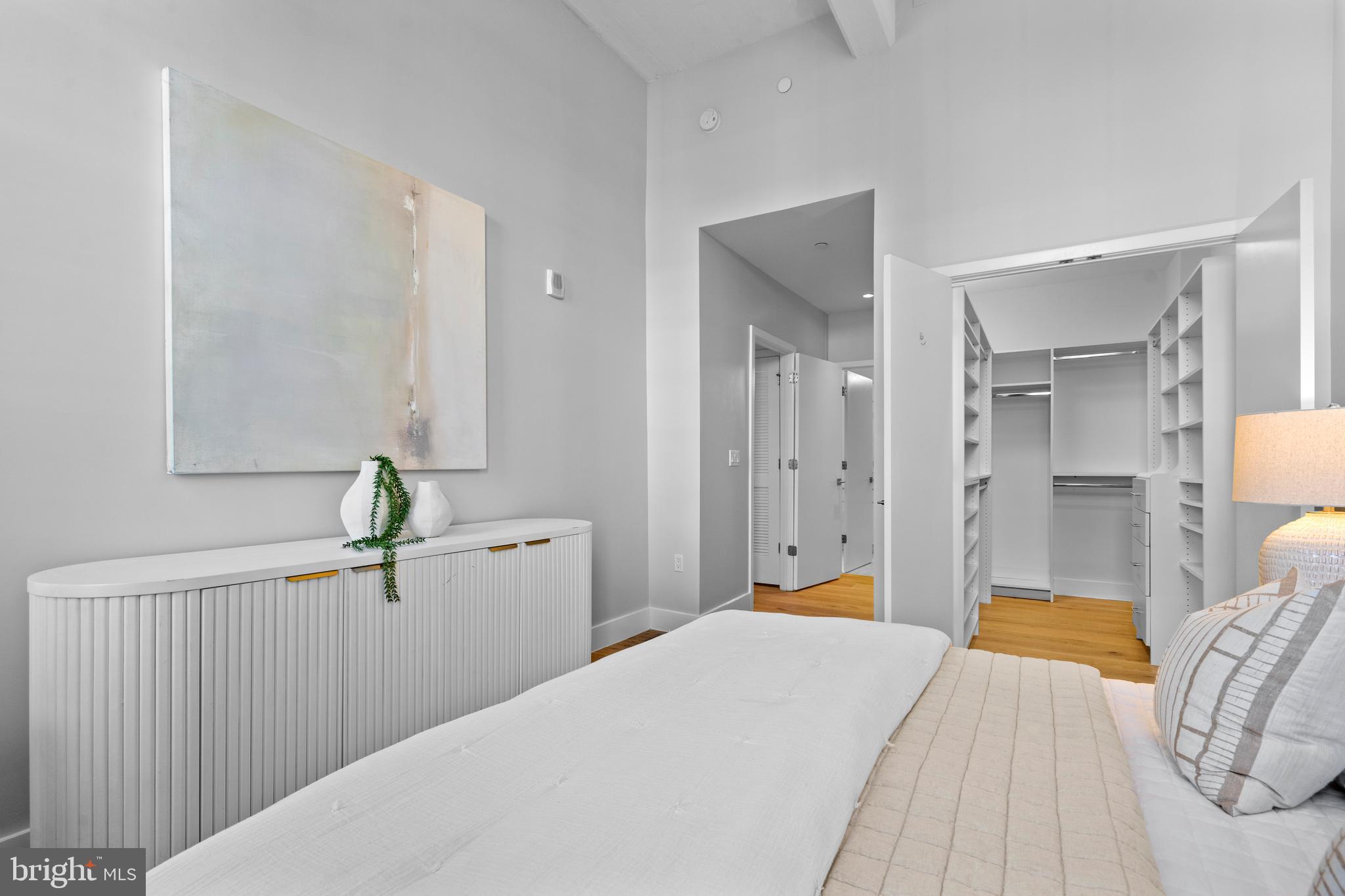 1324 E Street Southeast, Unit 201 Washington, DC 20003 - Photo 23 of 47 a bedroom with a bed and hallway