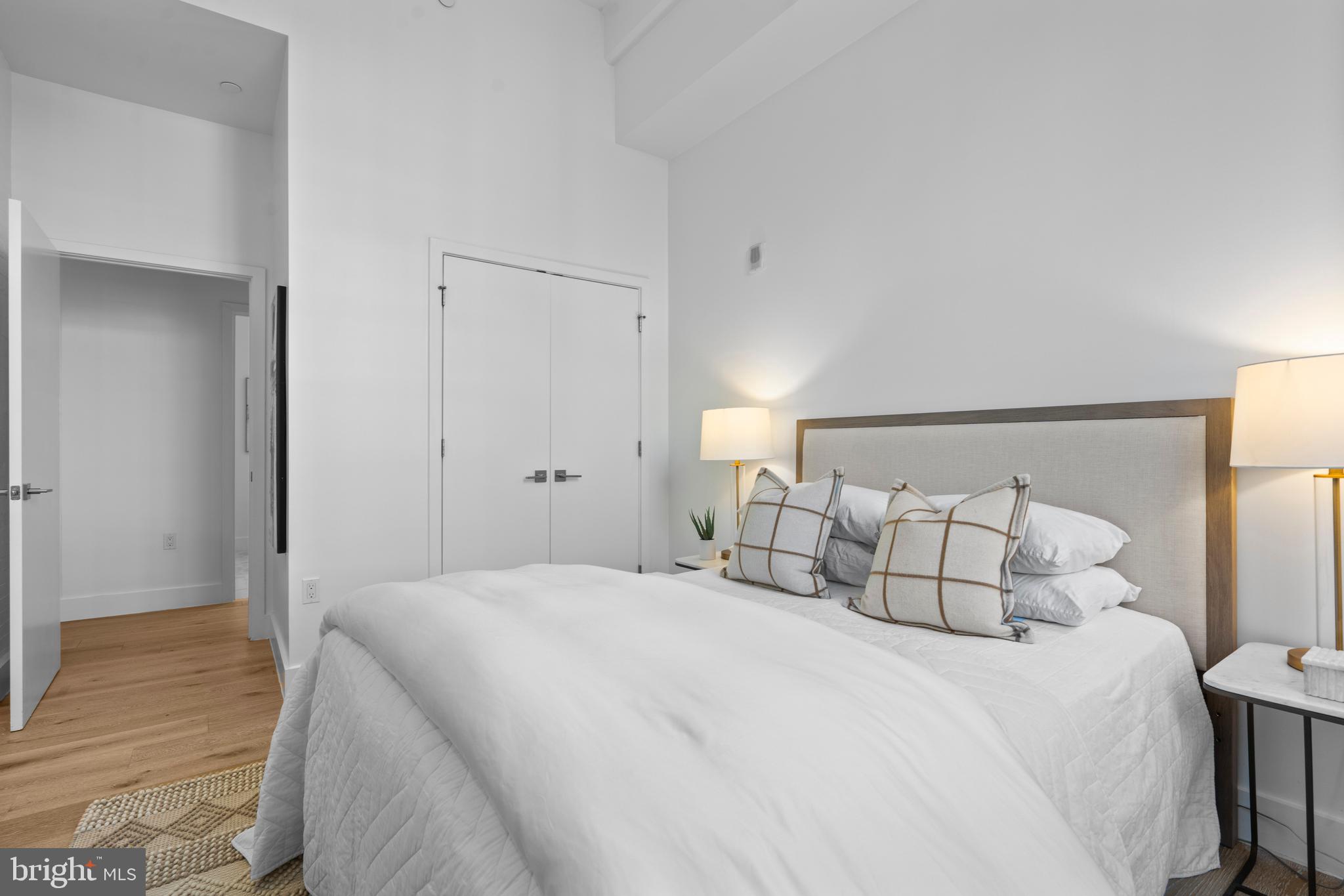 1324 E Street Southeast, Unit 201 Washington, DC 20003 - Photo 32 of 47 a bedroom with a bed and wooden floor