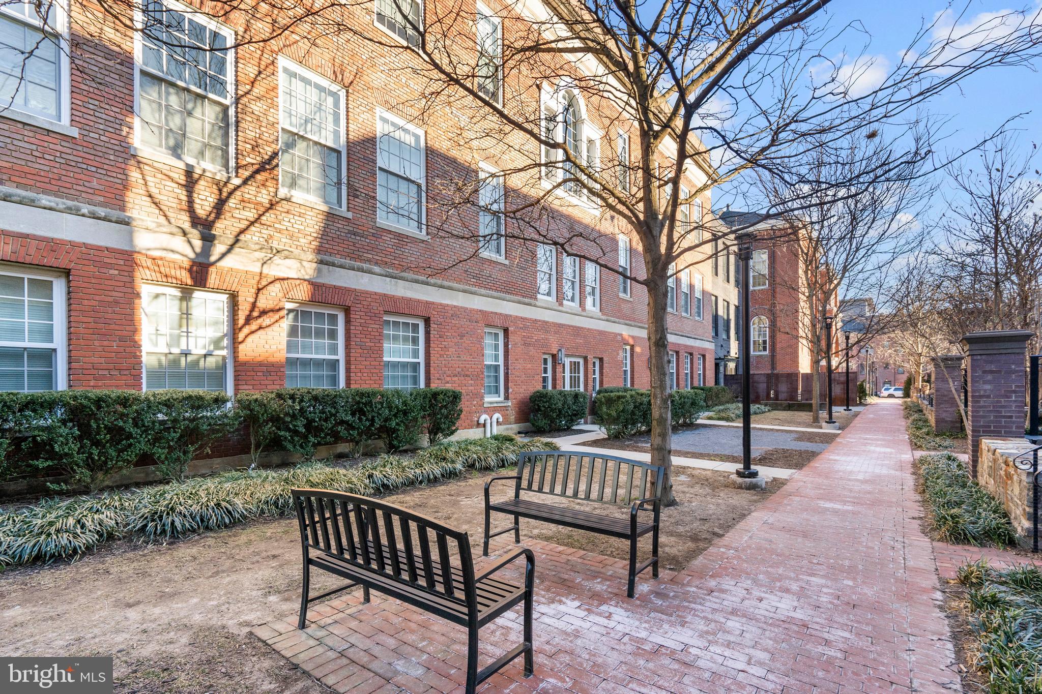 1324 E Street Southeast, Unit 201 Washington, DC 20003 - Photo 46 of 47 a view of a brick house with backyard and a trees