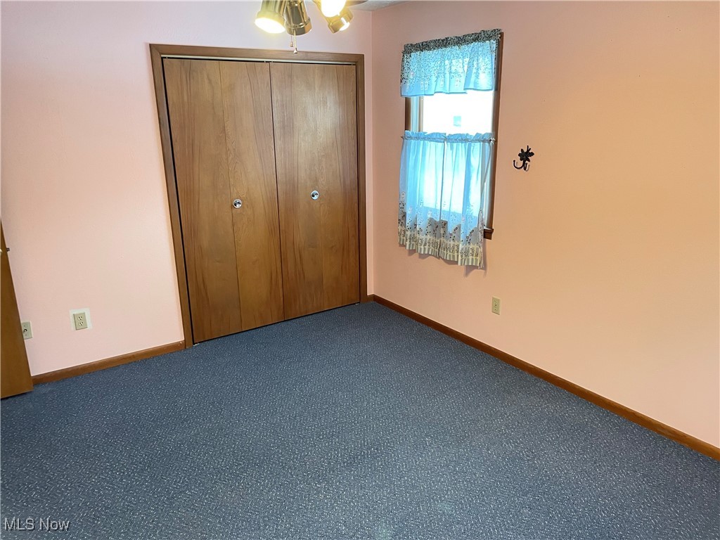 1381 Robb Road Conneaut, OH 44030 - Photo 24 of 50 Unfurnished bedroom featuring carpet flooring and a closet