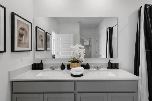 a kitchen with a sink and a mirror
