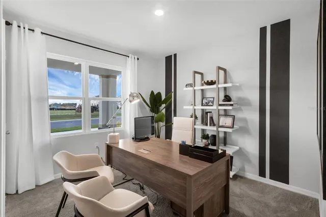a dining room with furniture and window
