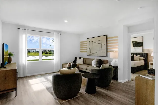 a living room with furniture and a window