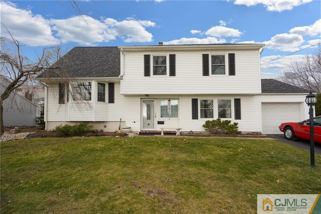 6 Meyer Road Edison, NJ 08817 - Photo 2 of 32 a front view of a house with a yard