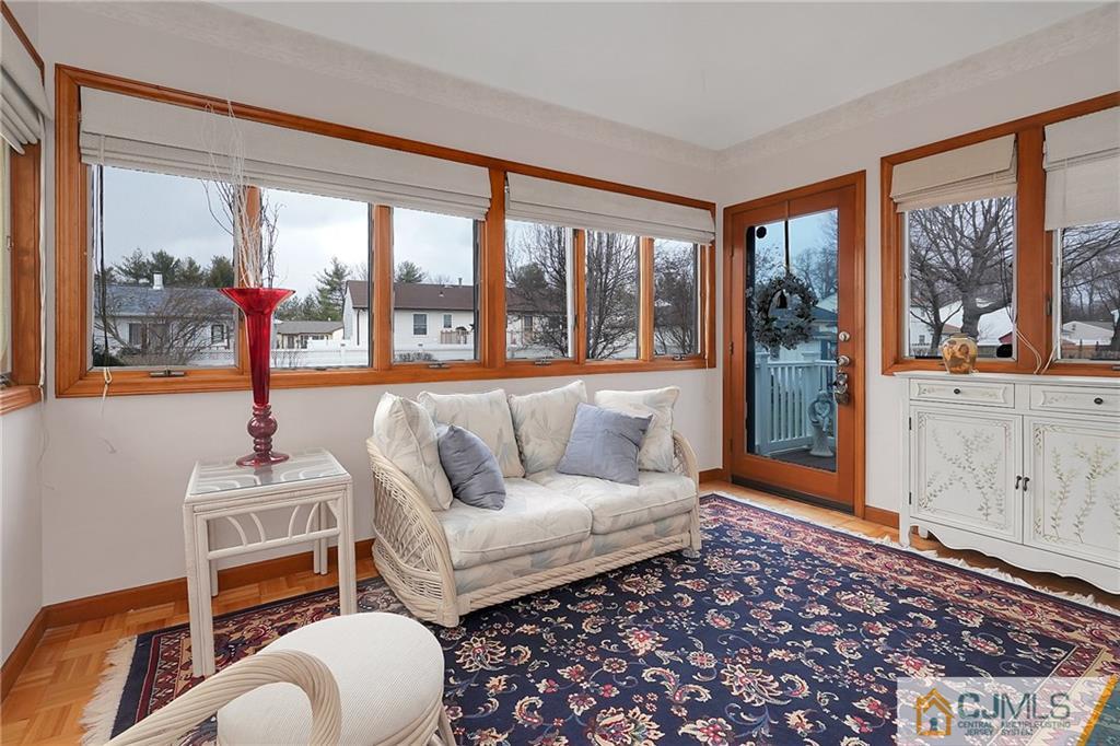 6 Meyer Road Edison, NJ 08817 - Photo 11 of 32 a living room with furniture and a large window