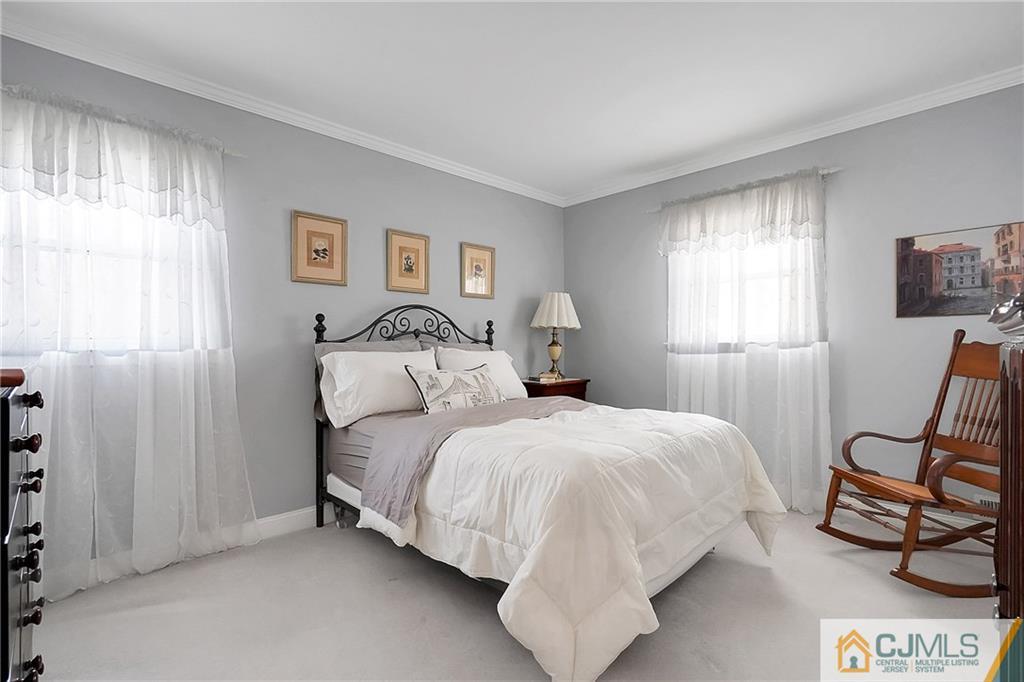 6 Meyer Road Edison, NJ 08817 - Photo 19 of 32 a bedroom with a bed and a window