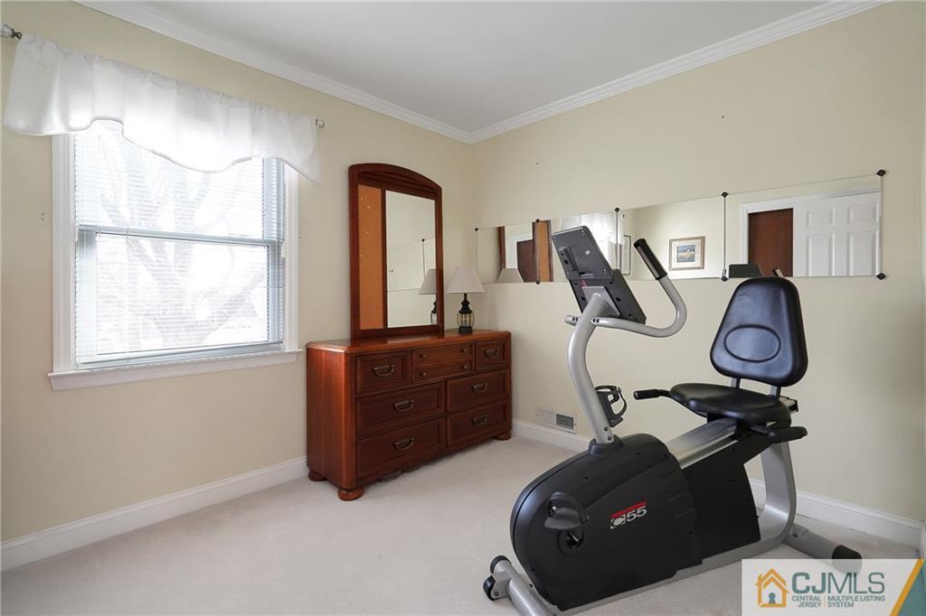 6 Meyer Road Edison, NJ 08817 - Photo 20 of 32 a room with furniture and a window