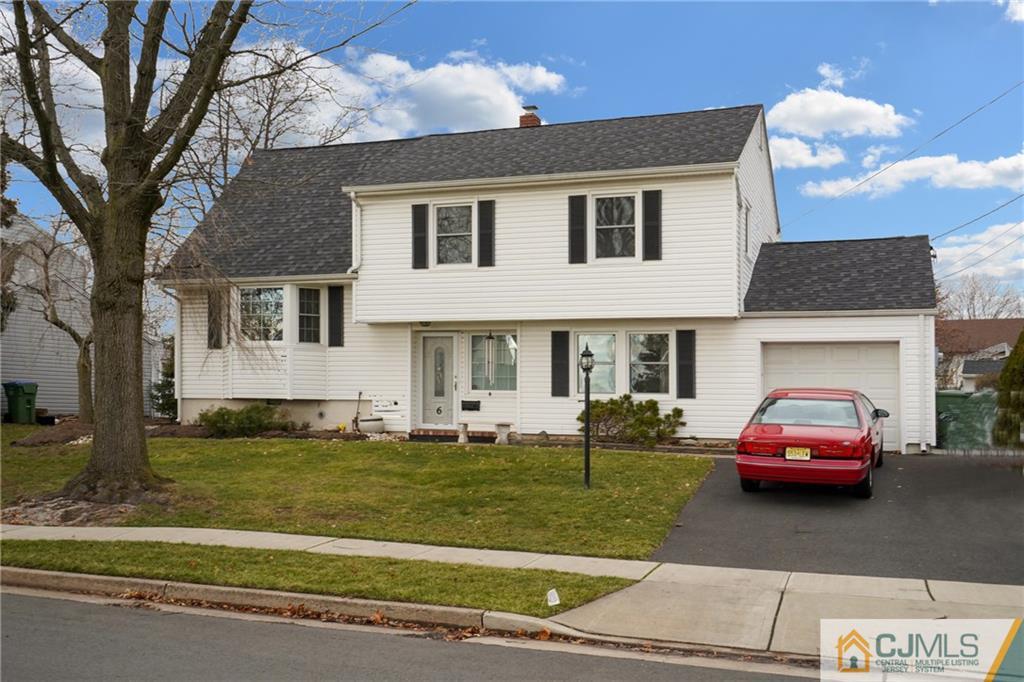 6 Meyer Road Edison, NJ 08817 - Photo 3 of 32 a car parked in front of a house